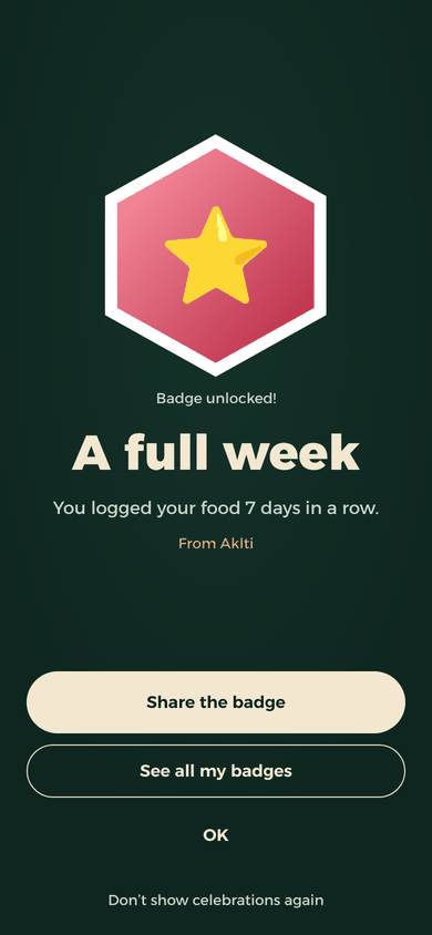 The “A full week” badge celebration: you logged your food 7 days in a row, with a share button.